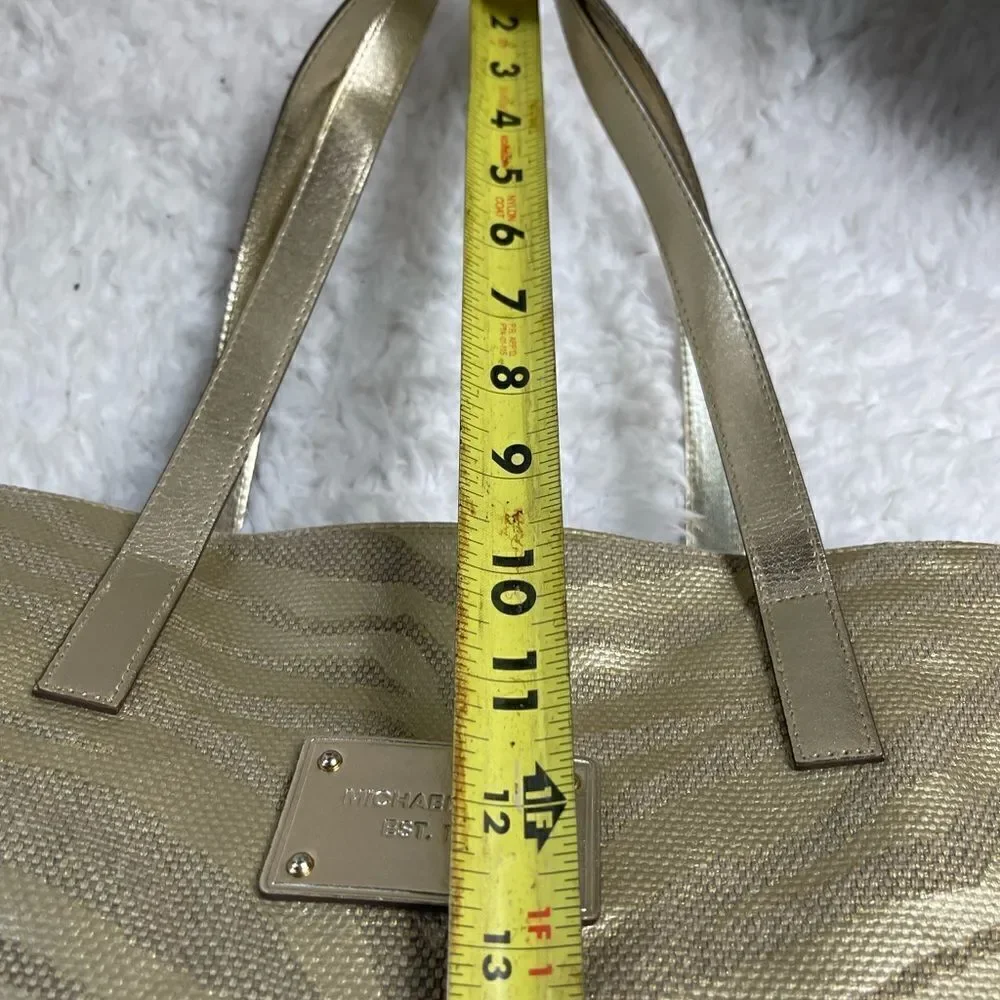 Michael Kors Metallic gold zebra print large tote gold tone hardwares and straps